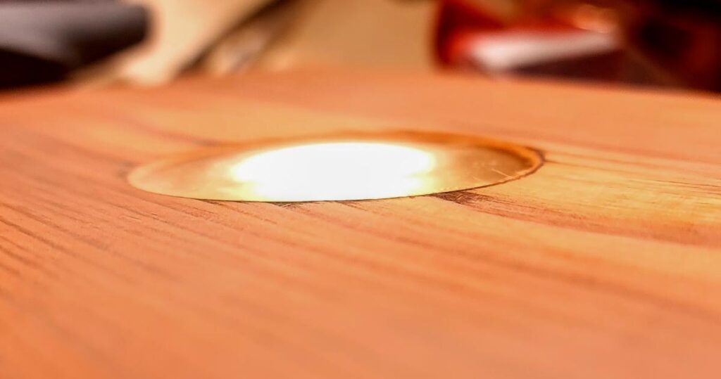 a terrace light recessed horizontally into the deck planks